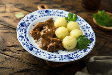 Homemade beef goulash with potato dumplings