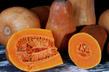 autumn gifts, juicy pumpkin on the table