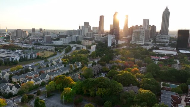 Atlanta Georgia skyline at sunset. Aerial establishing shot of downtown Atlanta GA housing and skyscrapers on skyline.