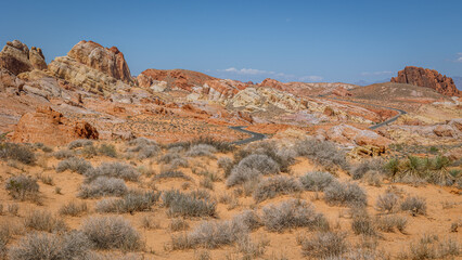 Driving and walking through the Valley of Fire State Park, formed by shifting sand dunes to red sandstone formations, also called Aztec Sandstone, Nevada, USA