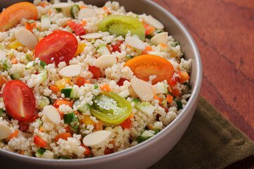 Couscous with vegetables in a rustic bowl. Moroccan couscous. Selective focus.