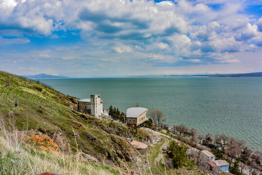 Beautiful view of Sevan lake with turquoise water and green hills, Sevan, Armenia. May 6, 2019.
