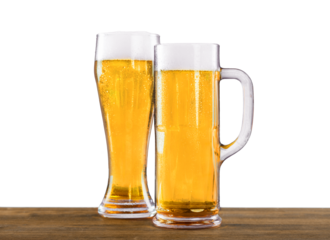 Cold beer with foam in glasses, close-up