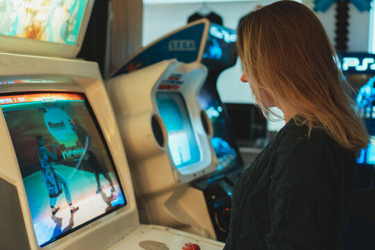 Tallinn, Estonia - 21.05.2022: LVLup! Video Game Museum, Woman playing game.