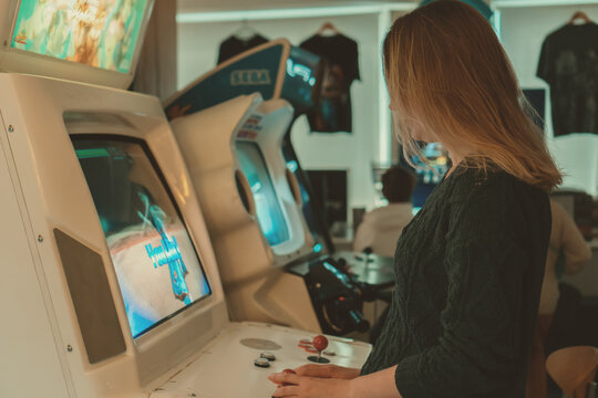 Tallinn, Estonia - 21.05.2022: LVLup! Video Game Museum, Woman playing game.