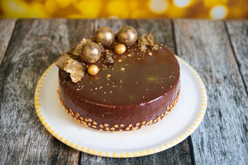 New Year cake decorated with gold chocolate balls