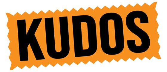 KUDOS text written on orange-black stamp sign.