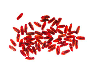 Heap dried Barberry berries, top view isolated on white background. Ripe dry sour-tasting berries, healthy seasoning for food. Red Barberry food. Healthy and tasty spice, top view cutout