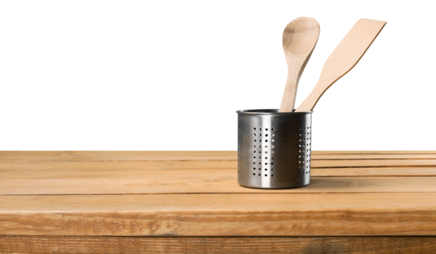 Wooden kitchenware in metal bowl isolated on white background