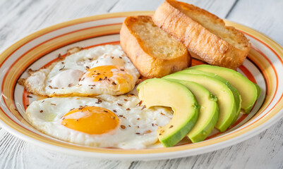 Fried eggs with avocado