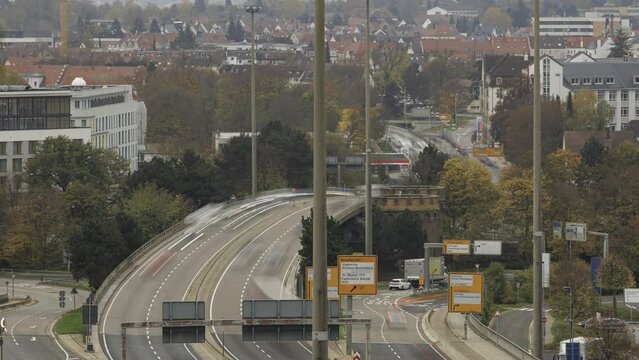 Time lapse shot of the main road B10 through Ulm on a gray day in autumn.
