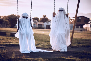 Park, halloween and friends in a ghost costume in a kids playground in celebration of a scary...