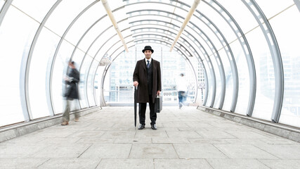 The City Gent, A Business Portrait. A traditional London businessman with bowler hat in a modern urban environment. From a related image series.