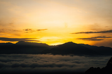 Sea clouds during golden sunrise above the Titiwangsa range mountains in Lenggong, Perak.