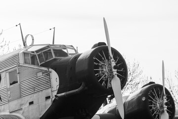 Cockpit and mid-engine of a three-engine old Junkers JU52 transport and traffic plane also called...