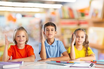 Fototapeta premium Cute kids students with classmates at school