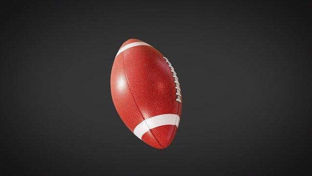 american football isolated on black background