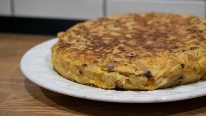 Delicious homemade potato omelet with onion. Traditional Spanish tortilla.
