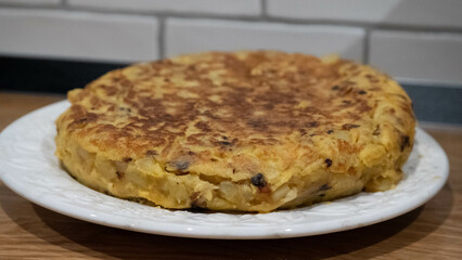 Delicious homemade potato omelet with onion. Traditional Spanish tortilla.