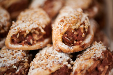 Beautiful and delicious tube cakes with brown cream and nuts
