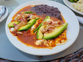 Panela cheese breakfast plate with sauce, egg and beans