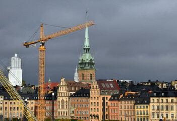Naklejka premium View the old town of Stockholm name Gamla Stan, and the tower of Riddarholm church