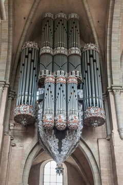 Great view of the so-called swallow's nest organ, the main organ attached to the historical location on the north wall of the High Cathedral of Saint Peter in Trier, Germany. 