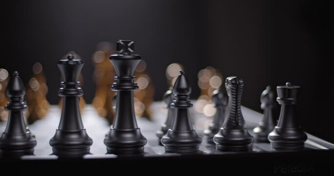 Sliding shot of a metallic chess set ready to play.