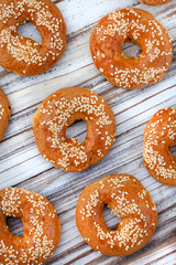 Flat lay of Greek Koulourikia biscuits on rustic wooden surface