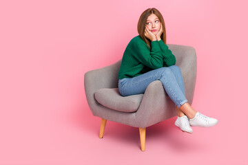 Full length photo of doubtful funny girl dressed knitted pullover arms cheeks looking empty space isolated pink color background