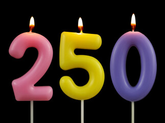 Colorful birthday candles isolated on black background, numbers  250
