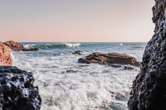 Sea splashing near rocky shore