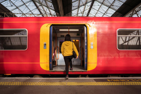 Female passenger entering train