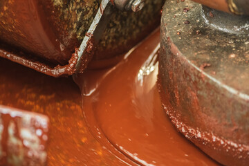 Old vintage grinding machine making chocolate, close up