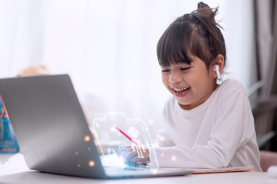 Little Asian girls remotely learn online at home by coding robot cars in STEM, STEAM, mathematics engineering science technology computer code in robotics for kids concept.