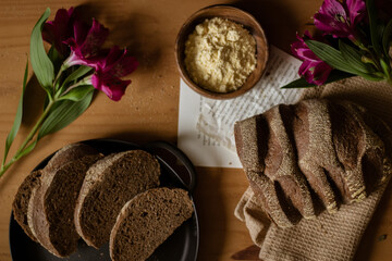 Brown bread on wooden table. Flat lay, top view. Bakery concept.