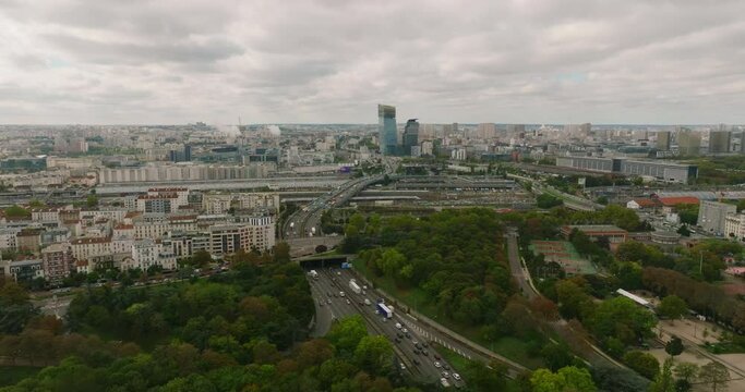 Wide drone aerial view flying above buildings roofs. Paris city attractions, France