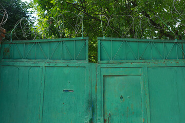 old gates with barbed wire.Trespassing area © Igor