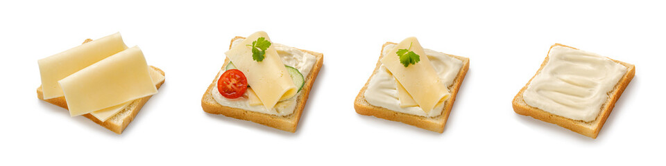 Set of toasts with melted and sliced cheese on bread. Assortment of sandwiches with gouda cheese, tomatoes, cucumber isolated on a white background with clipping path. Top view.