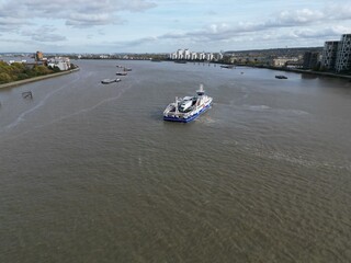 Woolwich ferry crossing River Thames London UK drone aerial view