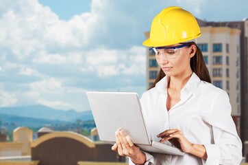 Young female engineer controls operation at work