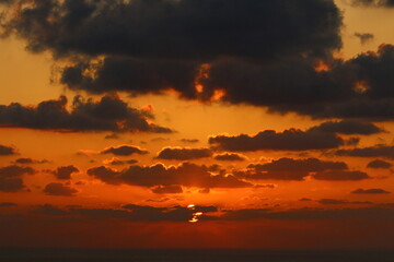 The sun sets below the horizon on the Mediterranean Sea in northern Israel.