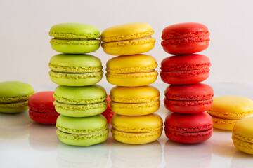 Cake macaron or macaroon on marble background, colorful almond cookies, pastel colors, vintage card. Folded colorful macaroons, traditional French dessert, macaroons