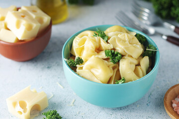 A bowl with Italian dumplings - tortellini