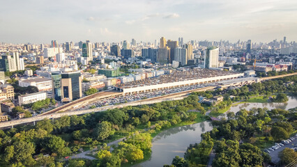 Aerial view of Beautiful cityscape and forest park , City center in sunset.