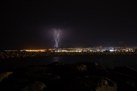 Lightning over city skyline