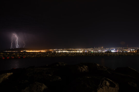 Lightning over city skyline