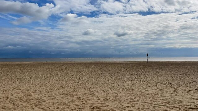 Beach and sea timelapse with fast moving clouds. Taken in Lowestoft England. 
