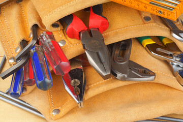 Manual worker tool set over a wooden background