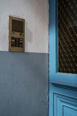 Video intercom on the wall, at the front door of the building. Security concept.